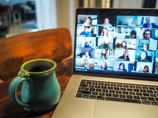 Photo of a laptop showing a video call